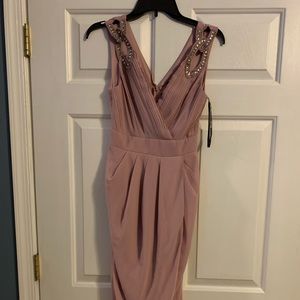 New with tags comes below knee never worn dusty rose with silver on the straps